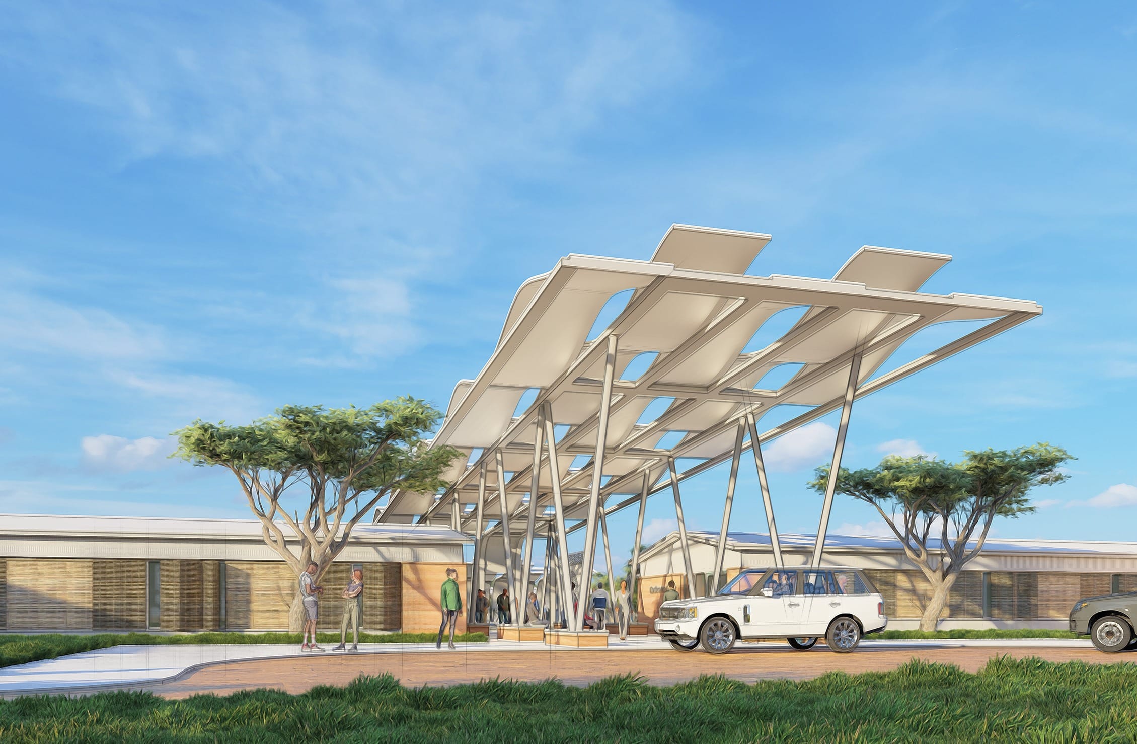 This image shows an architectural rendering or concept illustration of a modern healthcare facility entrance. The design features a prominent covered drop-off area with a distinctive cantilevered roof structure supported by columns, creating a protected arrival zone. Two vehicles are shown at the entrance - a white SUV/Range Rover directly under the canopy and a gray pickup truck nearby. Several people are depicted around the entrance, both arriving/departing and standing in conversation groups. The building itself has a horizontal, low-profile design with wood panel and glass elements. Two mature trees flank the entrance, adding natural elements to the composition. The landscape includes well-maintained grass areas and paved surfaces for vehicles and pedestrians. The rendering is shown under a bright blue sky with a few clouds, giving it an inviting, optimistic feel. The overall architectural style appears to emphasize accessibility, natural light, and a connection to the surrounding landscape - design elements that are commonly emphasized in modern healthcare facilities.
