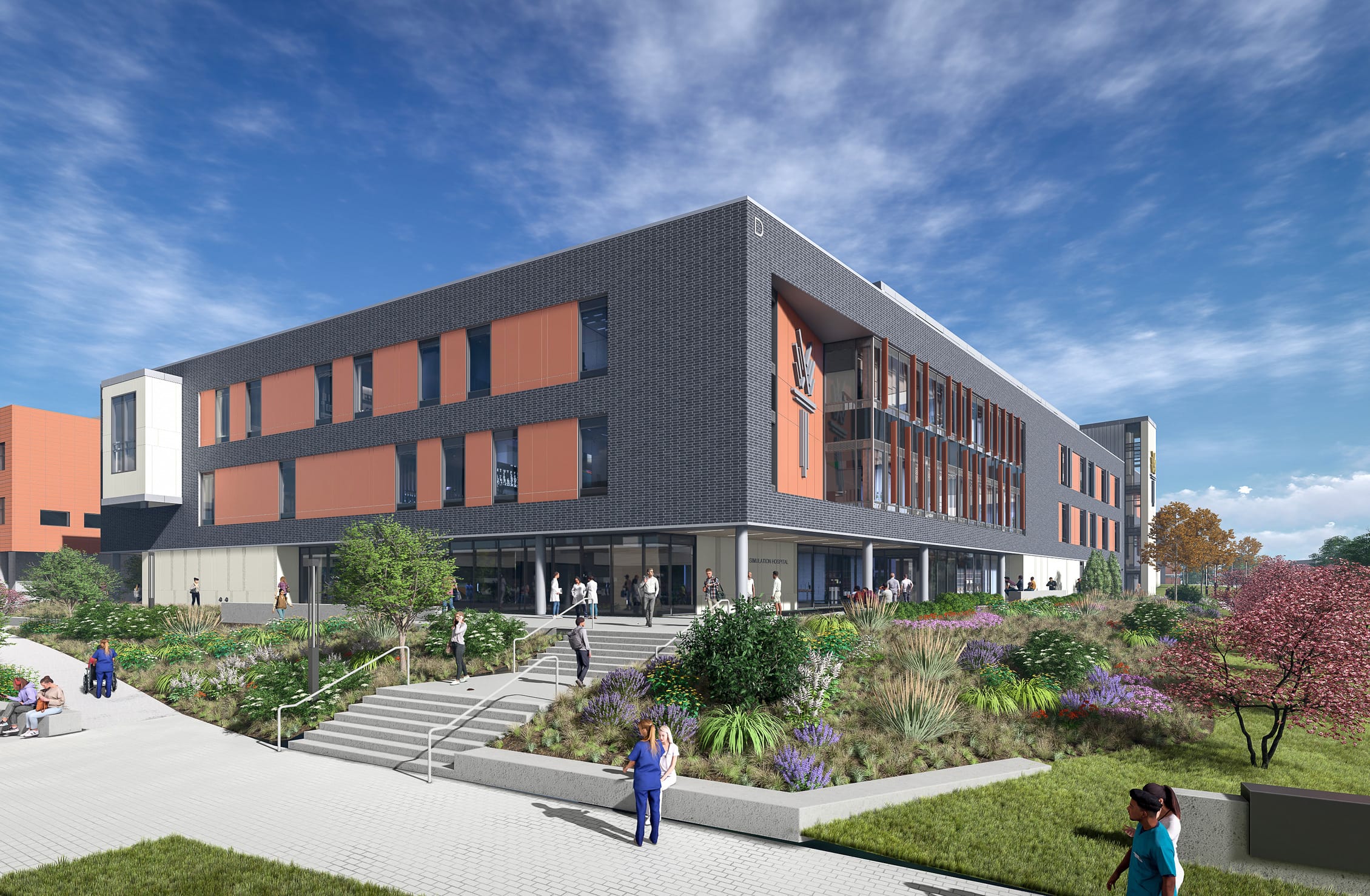 This rendering shows the exterior of the Wake Tech Health Sciences Building, featuring a modern three-story structure with dark gray brick cladding and distinctive terracotta-colored panels. The building has a clean, geometric design with large windows and glass entryways at ground level. The landscaping includes terraced gardens with native plants, ornamental grasses, and purple flowering shrubs surrounding stone staircases with metal handrails that lead to the main entrance. People in medical scrubs and casual clothing are shown walking along pathways and entering the building. The design incorporates sustainable landscaping elements with drought-resistant plantings. The scene is set against a bright blue sky with wispy clouds, and adjacent buildings can be partially seen, suggesting this is part of a larger campus complex.