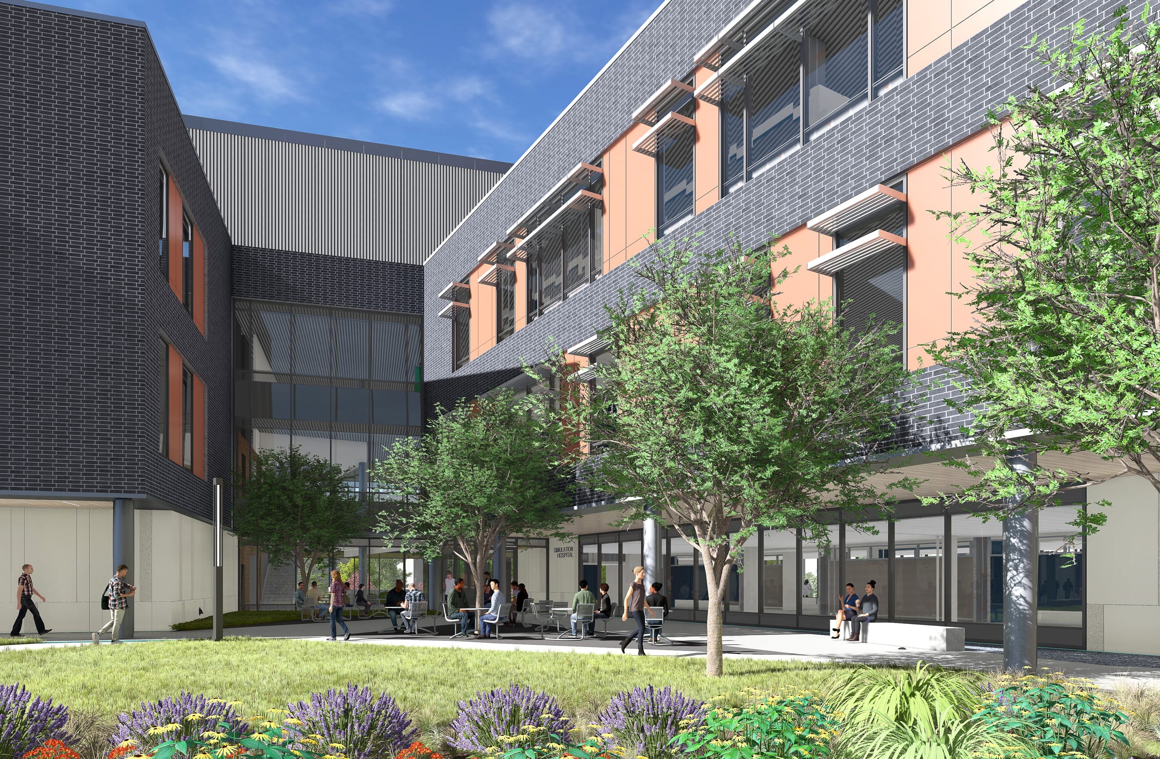 This rendering depicts an interior courtyard of the Wake Tech Health Sciences Building, showcasing how the building wraps around to create a protected outdoor gathering space. The architecture maintains the consistent design language with dark gray brick facades and terracotta accent panels. Several mature trees provide shade over seating areas where students can be seen socializing and studying. The ground floor features extensive glazing that allows views into interior spaces, while upper floors have solar shading devices over windows. The courtyard combines hardscaped areas with benches and tables alongside thoughtfully designed landscaping with flowering plants, ornamental grasses, and lavender. This green space creates a calm microclimate between building wings while offering students an outdoor extension of their learning environment under clear blue skies.