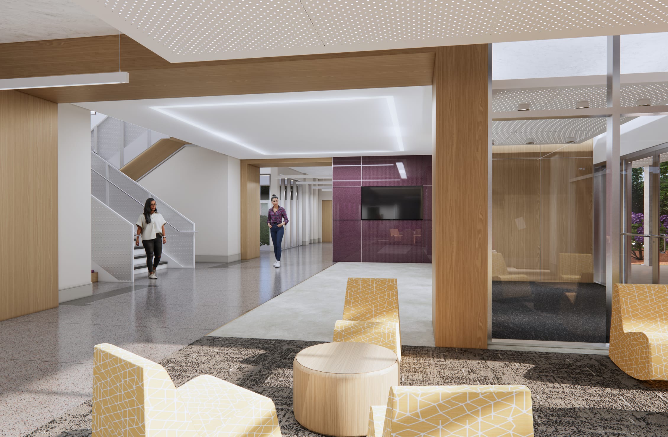 This rendering offers another perspective of Howell Hall's circulation and gathering spaces, showcasing the cohesive design approach throughout the building. In the foreground, a casual seating area features yellow geometric-patterned chairs and wooden round tables atop a gray area rug. The space flows into a main corridor where two students are shown - one descending the modern staircase with its distinctive white perforated metal railings and another approaching from a hallway. A large magenta accent wall with an integrated display screen anchors the space visually. Glass partitions on the right reveal additional seating areas and views to outdoor plantings. The design maintains consistent elements seen in previous images: perforated acoustic ceiling panels, warm wood columns and wall treatments, terrazzo flooring, and recessed linear lighting that enhances the contemporary academic environment.