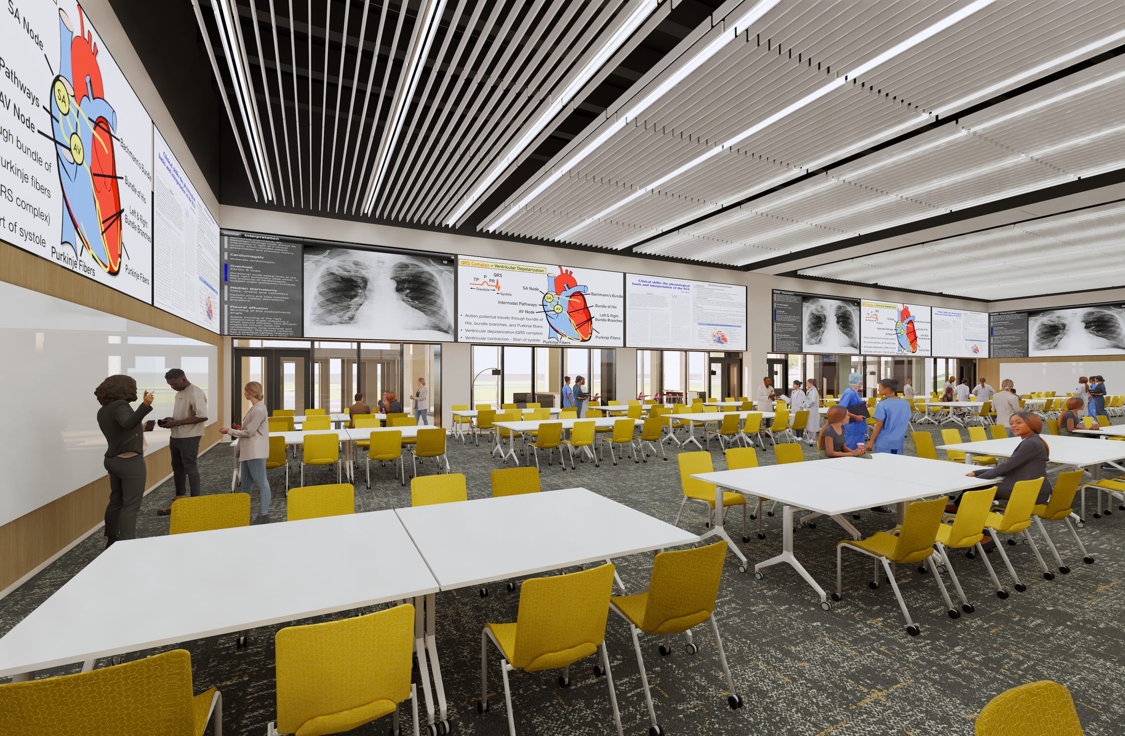 This rendering depicts a state-of-the-art medical education classroom or simulation space designed for collaborative learning. The Brody School of Medicine room features multiple large display screens showing anatomical images of the heart and lungs with detailed diagrams and X-rays, clearly intended for medical instruction. Bright yellow chairs surround white modular tables that can be configured for different teaching scenarios, all set on a dark patterned carpet. The ceiling incorporates a modern slatted design with integrated linear lighting. Glass partitions separate this main learning space from adjacent areas where students and instructors in medical attire (scrubs and white coats) are visible. Several people are engaged in discussion throughout the space, reinforcing its purpose as an interactive medical teaching environment where clinical concepts can be visualized and studied collaboratively.